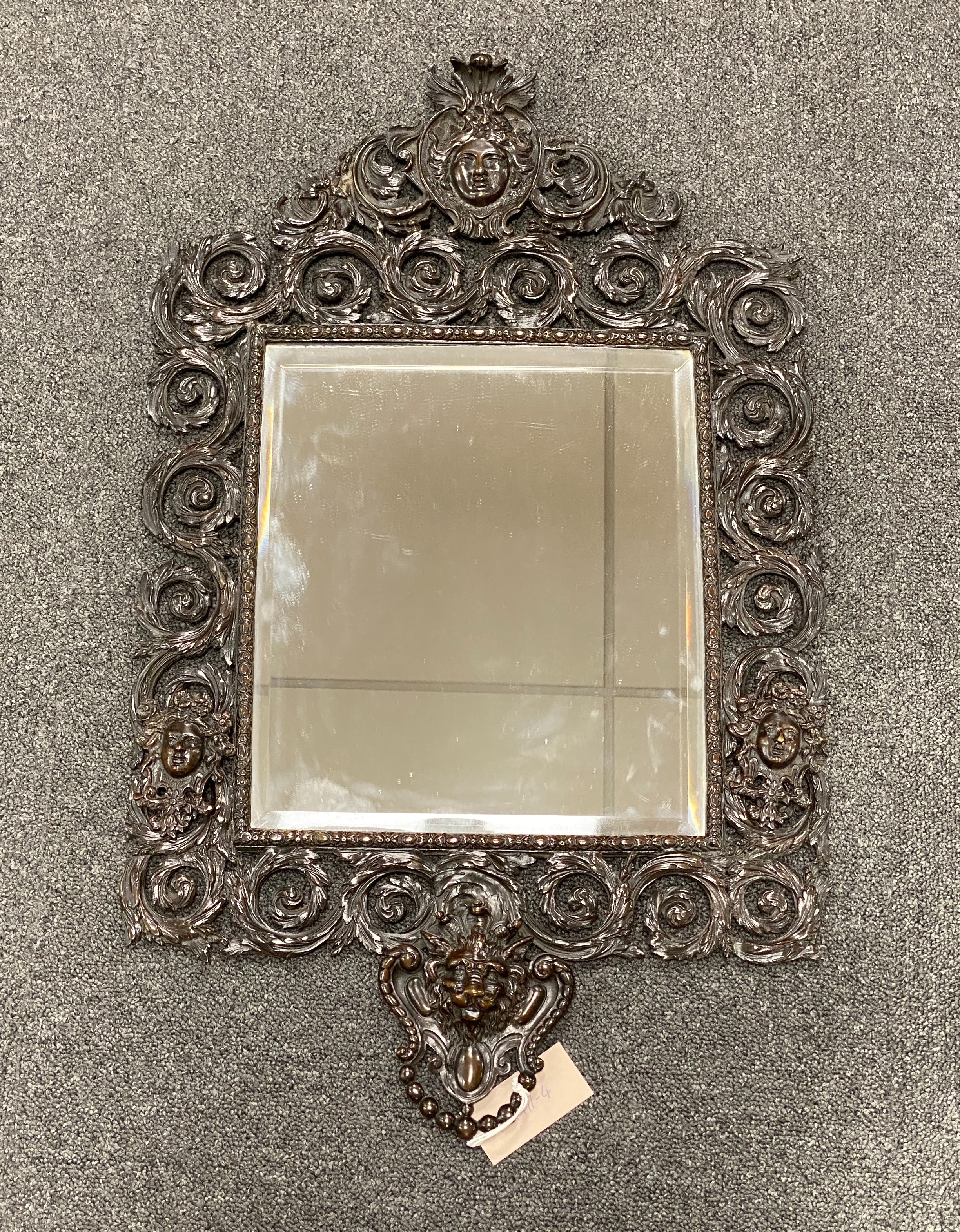 A late 19th century bronze wall mirror, 68 x 42 cm